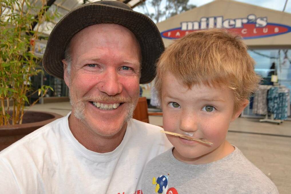 LITTLEST MO: The littlest "mo" for Team Narooma Plaza as worn by Riley, age 6, pictured with dad Warren Atkins.