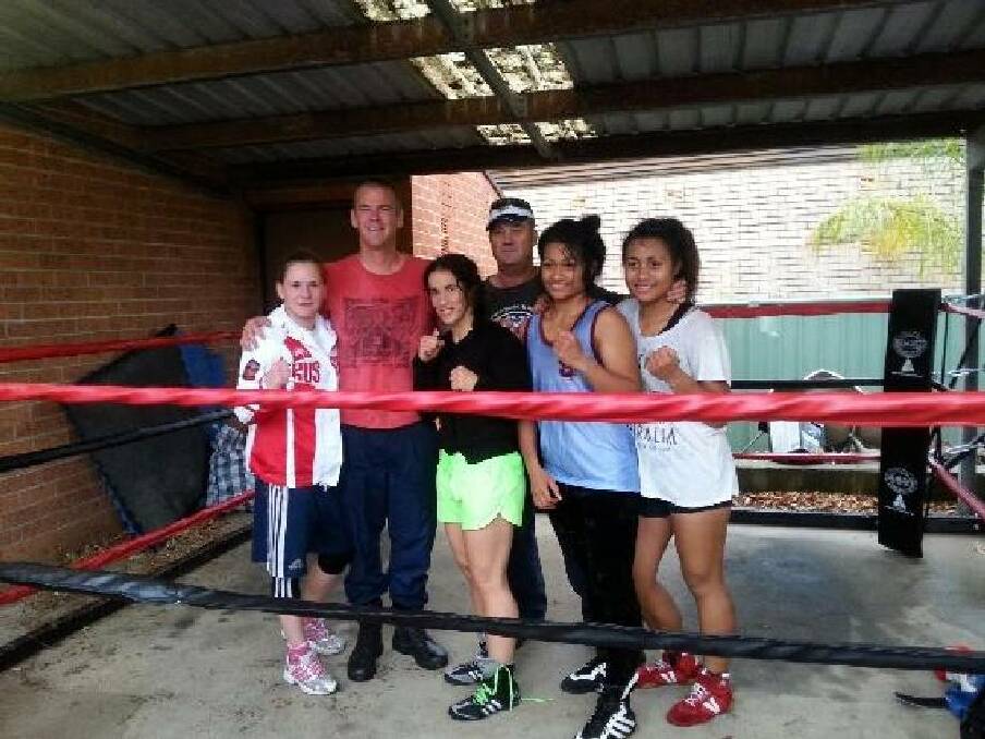 SPARRING TIME: Aleksandra “Sasha” Kuleshova, trainer Scott Wharfe, Bianca Elmir, trainer Steve Spears and two Samoan boxers Mattie and Nina Schuster.