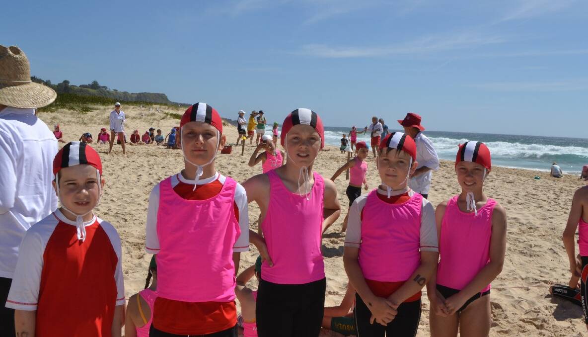 NAROOMA FLAG GROUP: Sam Perry, Thor Weston, Aiden Miles, Angus Patmore, Hayley Stubbs the Narooma under 10 Nippers waiting for their flags event to start at the first Far South Coast branch Nippers Carnival of the season held at Narooma on Sunday.