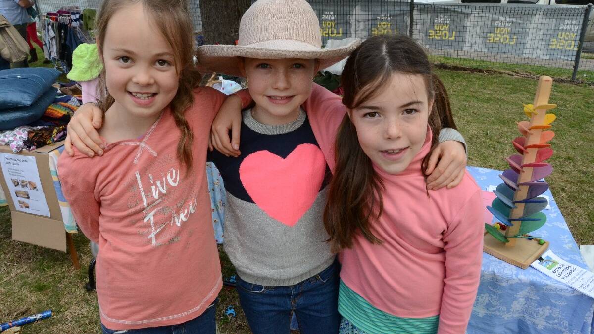 Islay McLeod, Sophie Way and Eleanor Wilden caught up at the Natures Nest Community Childcare Centre fundraising white elephant stall.