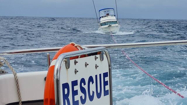Bermagui Marine Rescue tows a boat stuck out at sea. 