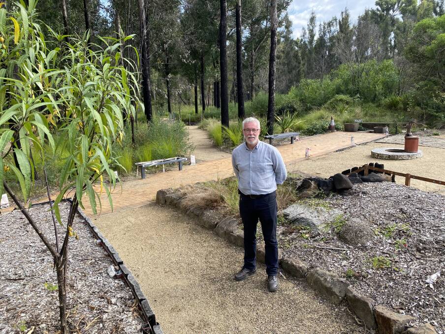 Eurobodalla Regional Botanic Garden manager Michael Anlezark in the existing sensory garden destroyed by fire, which will be replaced with a new $500,000 Forest Sensory Playspace. Photo: Supplied