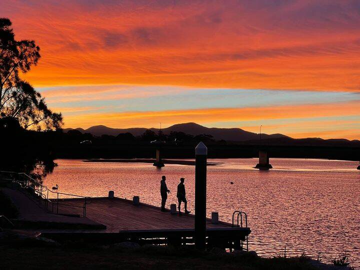 Life doesn't get much better than fishing as the sun sets, just ask these two fishos spotted in Moruya. Photo: Claudia Ferguson. 