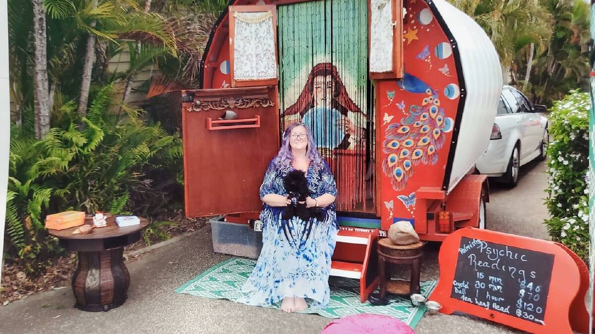 Kate Denning with her wagon where she performs tea-leaf readings, crystal-ball gazings, and palmistry. She will be in Batemans Bay at the Smart Market this weekend.