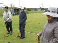 Golf croquet last Thursday in game 9, from left, Nevis Res, Louise Starkie and Mary Ryan assess the next play at hoop 9 with the black ball.