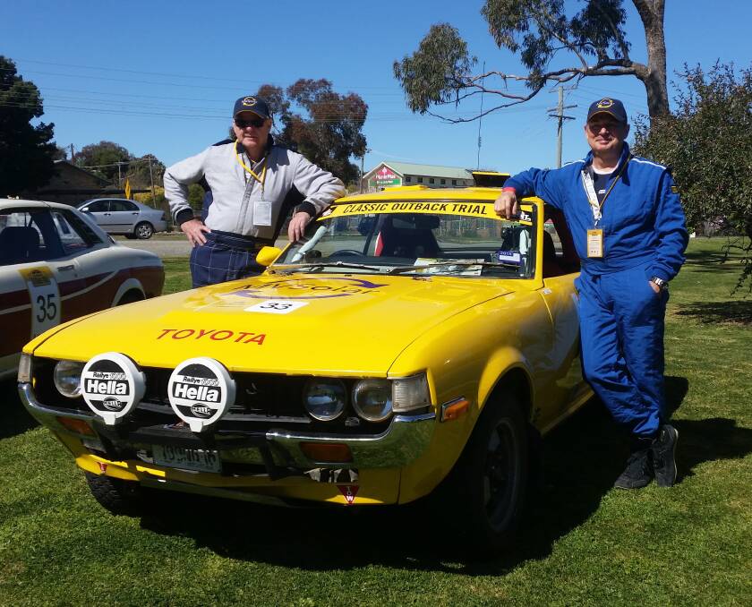 Peter Thompson and Ken Hind with the yellow Toyota Celica in 2014.