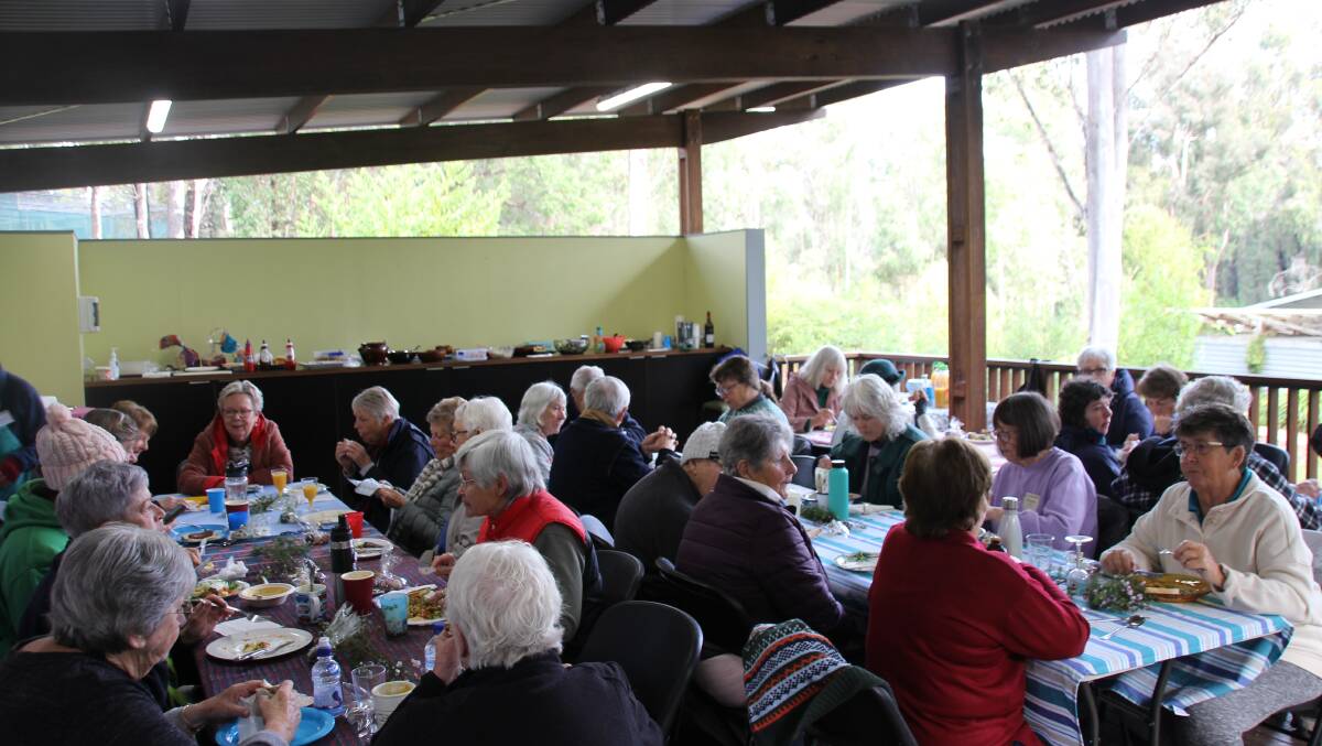 Members of the Eurobodalla Walkers enjoying their 35th birthday lunch at the Eurobodalla Regional Botanical Gardens.