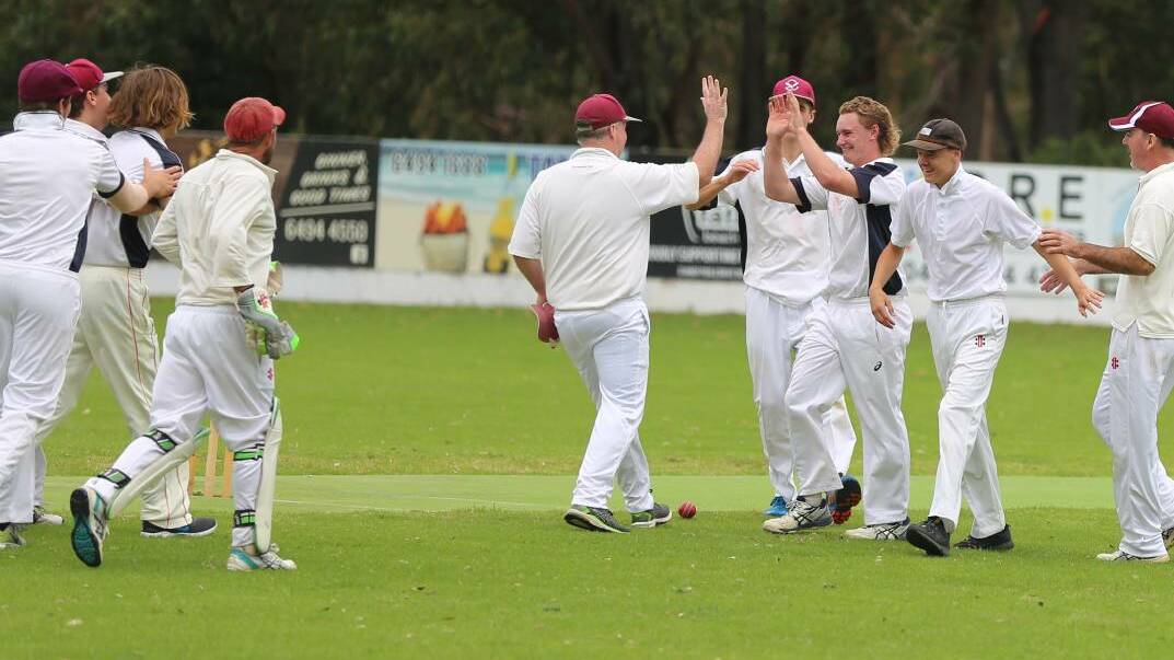 Tathra celebrates a wicket during last year's first-grade final.