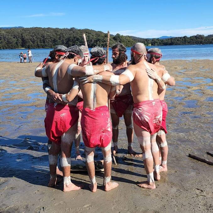 Members of Muladha Gamara group in a huddle after performing at the Narooma Oyster Festival
Picture: supplied