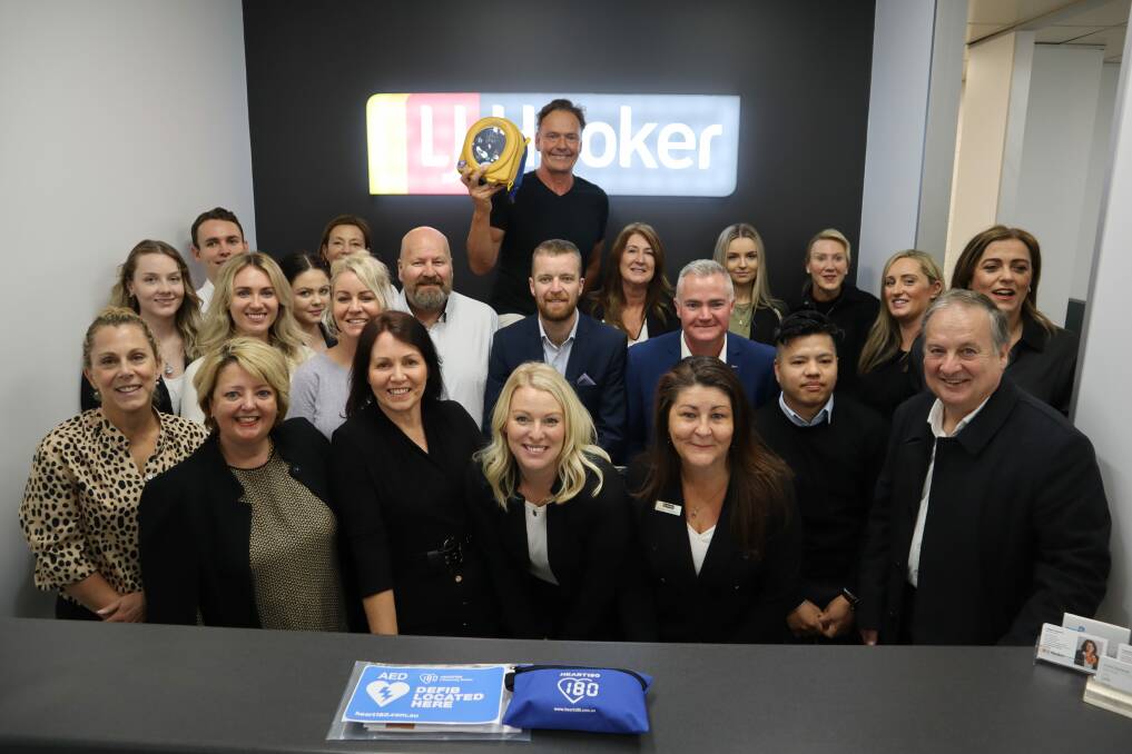 HEART STARTER: Guy Leech and real estate agents from LJ Hooker South Coast are getting more defibrillators in the community. Agencies at Nowra, Ulladulla, Sussex Inlet, Sanctuary Point, Vincentia, Batemans Bay, Moruya, Ulladulla, and Bowral now have machines. Picture: Jorja McDonnel