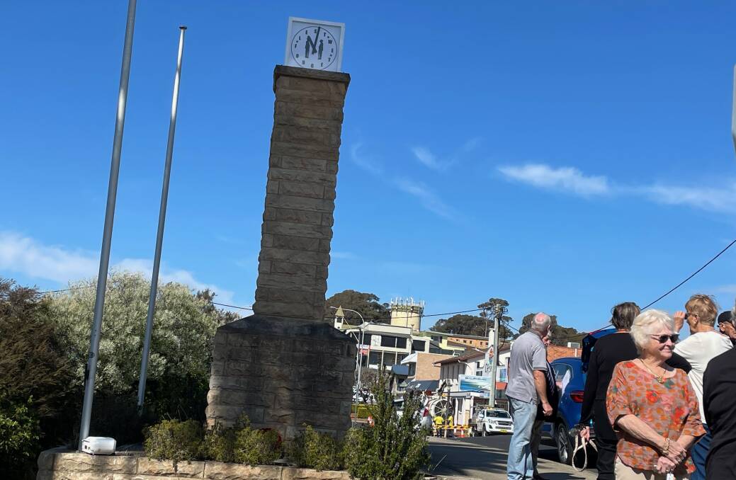 People gathered at the Narooma War Memorial Clock Tower for a sombre rededication ceremony on Tuesday, August 29. Picture by Marion Williams