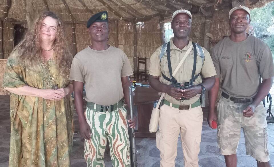 Motria von Schreiber with the team who saved Dr Carl von Schreiber's life: Dryton Phiri from Zambia Department of National Parks and Wildlife, Conservation South Luangwa senior guide Stephen Banda and junior guide Sasu. Picture supplied.