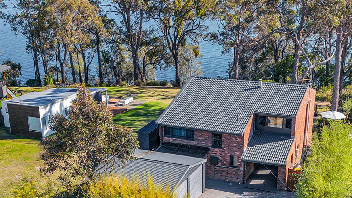 Tony King and Kris Ralph's home on the shores of Wallaga Lake looks north to Gulaga. Picture supplied