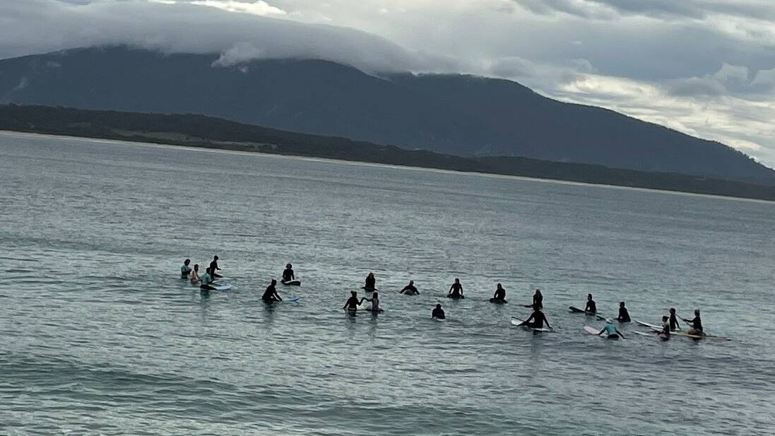 Kirsty Furbank, founder and head coach of Camel Rock Surf School, led the community paddle-out from Bermagui's Horseshoe Beach to welcome the whales