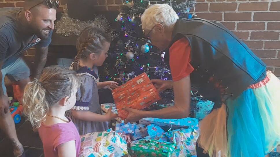 Distributing presents to kids at Cobargo at last year's Toys for Kids Run. Picture supplied