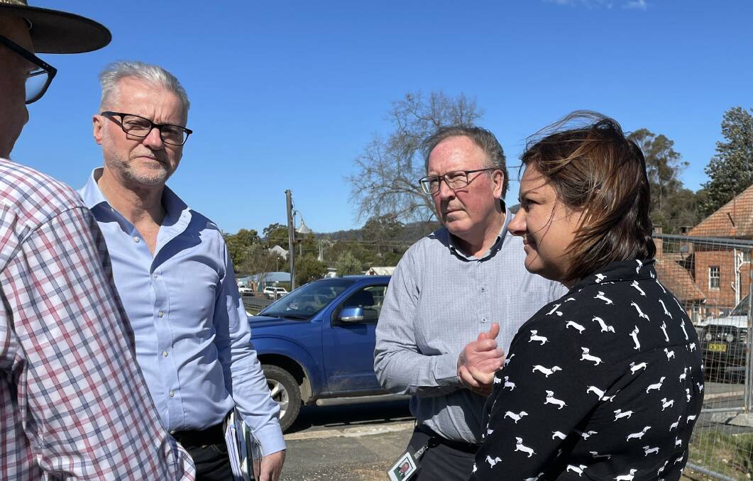In August 2022, on the edge of the Cobargo Rebuild site John Waters explained the situation to inaugural federal Special Envoy for Disaster Recovery Tony Sheldon, member for Bega Dr Michael Holland and member for Eden-Monaro Kristy McBain. He told them if the rebuild did not go ahead "it would be the death of the school, doctors would leave and the people who would be left here would slowly atrophy'. Picture by Marion Williams