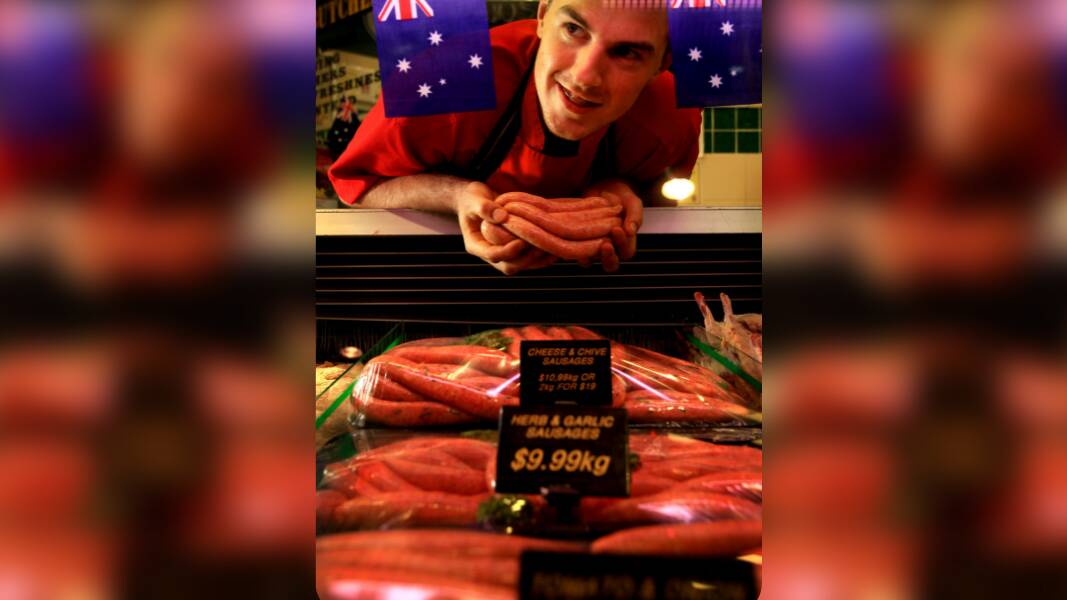 Vegemite and cheese sausages with Manager Ethan Patfield in 2011. Picture by Simone De Peak