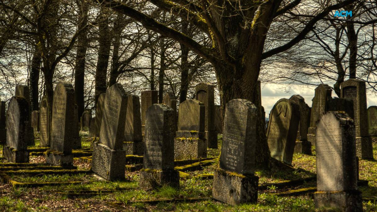 Gravestones in a cemetery. Picture via Canva
