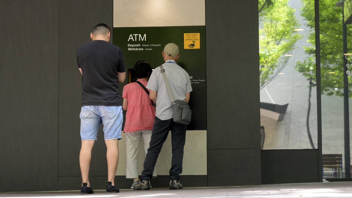 Lunchtime queues at ATMs are not what they used to be. Picture by Keegan Carroll 