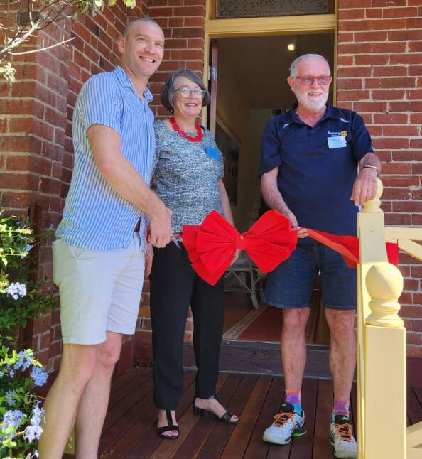 Cr Hatcher, Ms Murphy and Mr Anderson cut the ribbon to officially open the verandah. Picture supplied