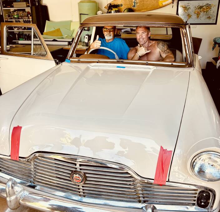 On his last day outside the house before being confined to bed, John Smith is joined by son Lucas as he checks out his Ford Zephyr. Picture supplied.