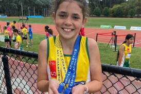 Rising athletics star Lacey Lee took home four medals at the Under 9 to Under 13 ACT Athletics Championships. Photo supplied.