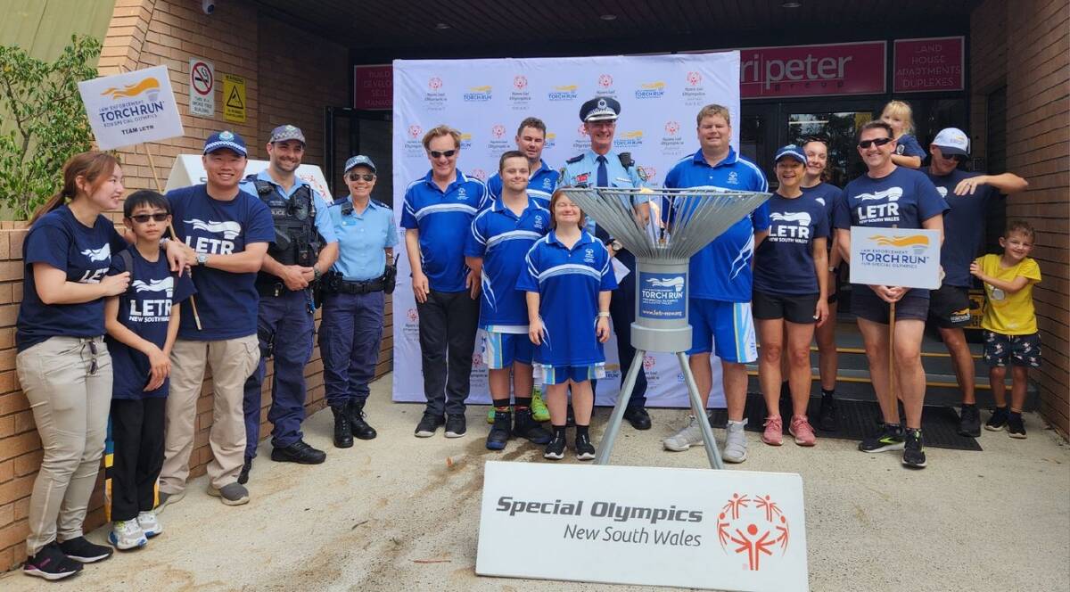 South Coast basketball players with the Law Enforcement Torch Run members at the competition's opening ceremony. Picture supplied.