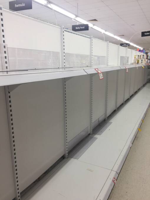 The almost empty toilet paper shelves at a Eurobodalla Shire supermarket on March 5. A few rolls can be spied in the distance.