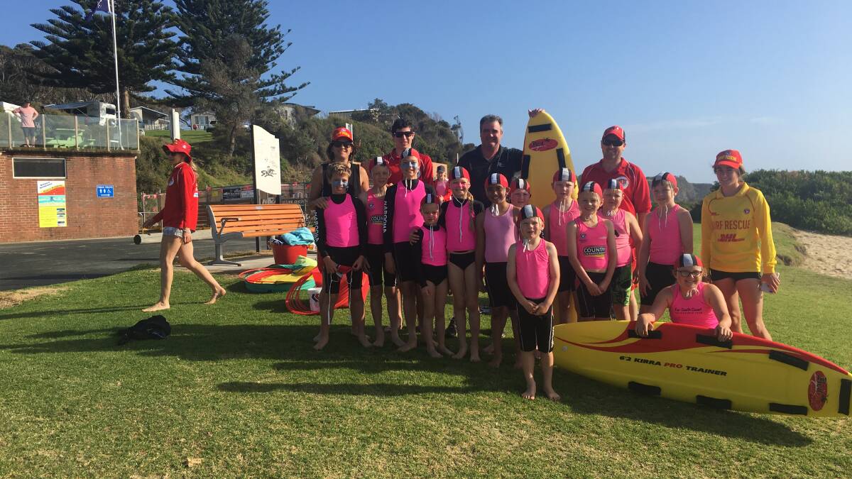 Narooma Nippers with coordinator Kristy Beecham and Club Narooma general manager Tony Casu, who has donated funds for a new IRB.