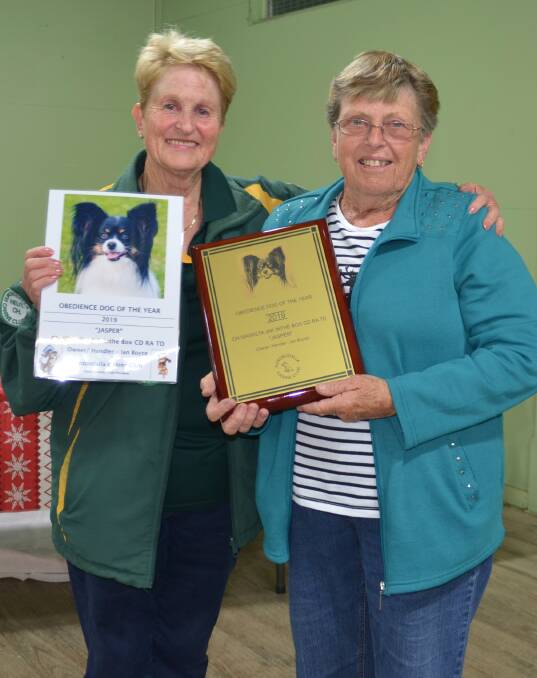 Jan Boyce receiving her awards from Club President Hilary Coulton.