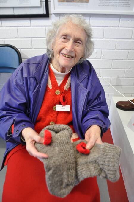 HOMESPUN: Marion Goard with her homespun and hand-knitted socks at the opening of "Narooma Remembers – Brave Hearts and Smiling Faces".