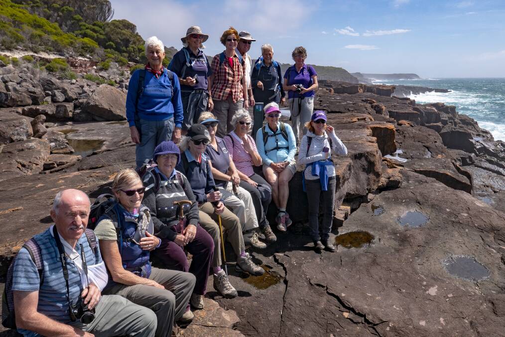 EFFORT REWARDED: The Dalmeny Narooma Bushwalkers on a rock platform at  Bittangabee Bay after another epic walk on the Far South Coast. 