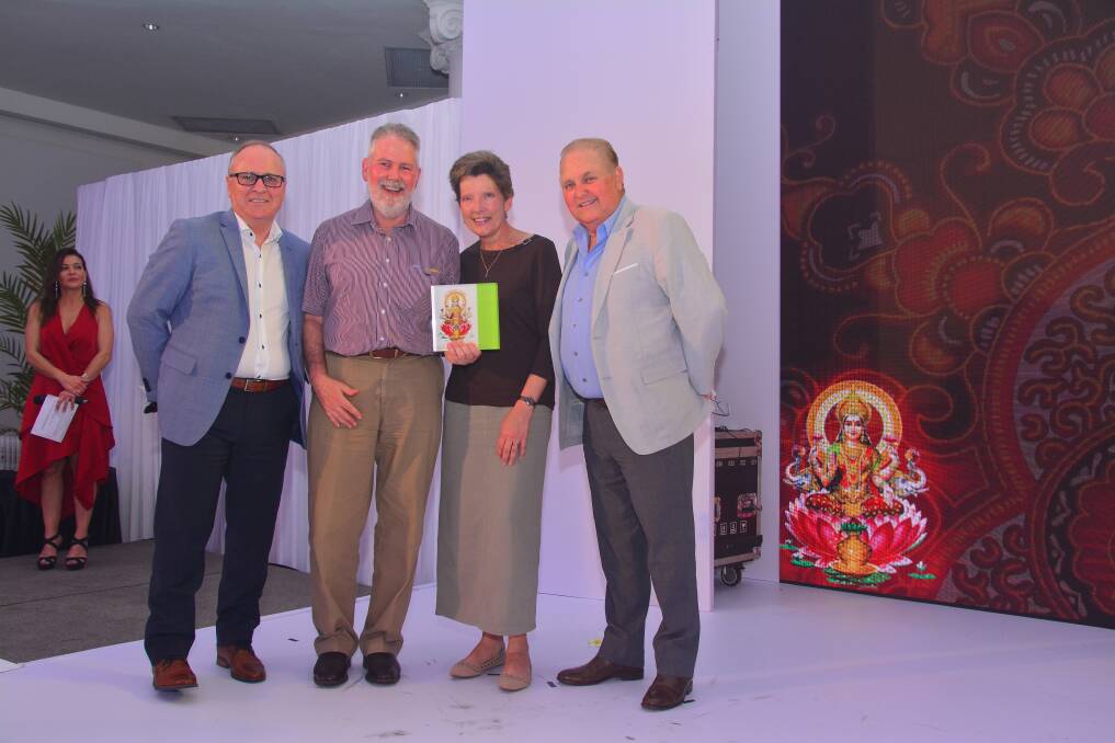 BIG WIN: Betta CEO Graeme Cunningham, Julian and Liz Barrington Smith, of Narooma, and Betta chairman Garry Thyer at the awards ceremony in Sri Lanka. The Smiths were named Betta than the rest.