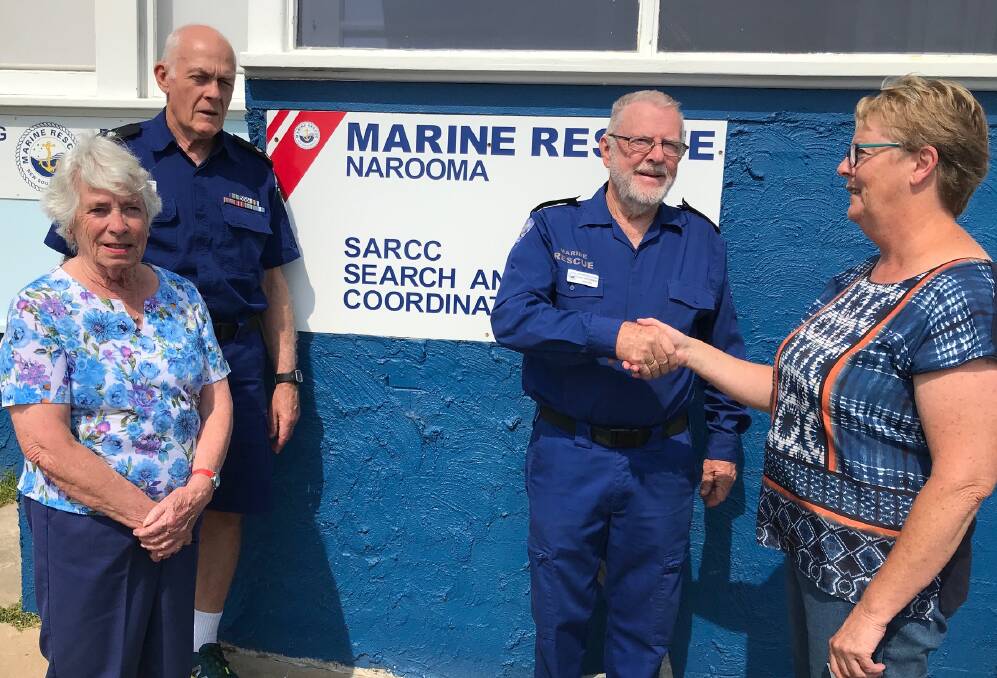 THANKS: Molly Worrall (Quota) and John Lundy (Marine Rescue) look on as Paul Houseman thanks Jenny Helmore for Quota Narooma's donation.