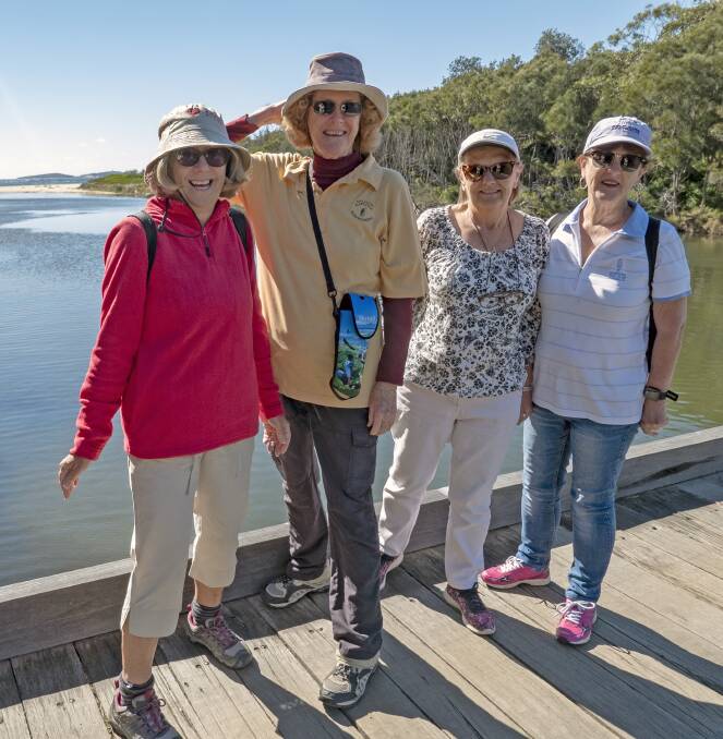 NICE VIEW: Walkers Narelle Spees (from left), Maggie Finch, Grace Lowe and Ann Durnan on Narooma waterway with Montague Island in the background.