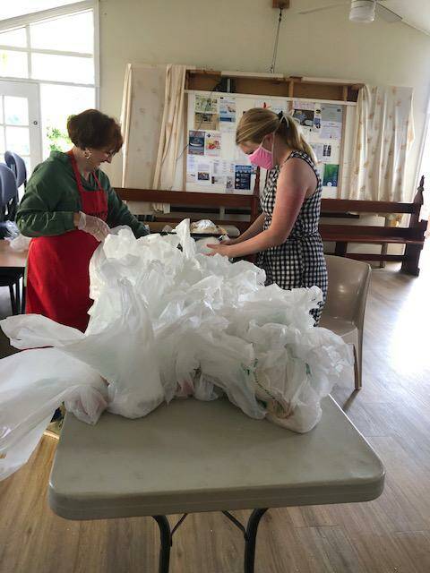 Hard workers: Getting stuck into packing takeaway bags at Monty's Place.