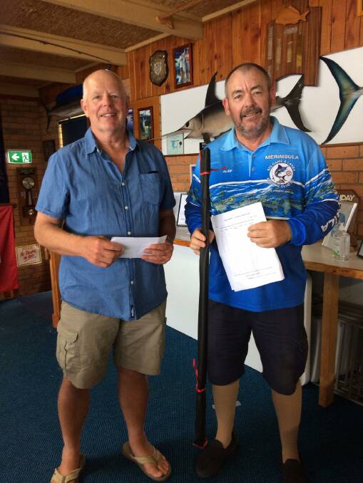 David Hay receives his first prize for bream from MBGLAC vice-president Alan Wilkins.