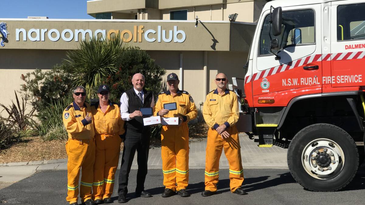Narooma Golf Club general manager Dominic Connaughton with Dalmeny-Kianga Rural Fire Service members after a new GPS was donated.