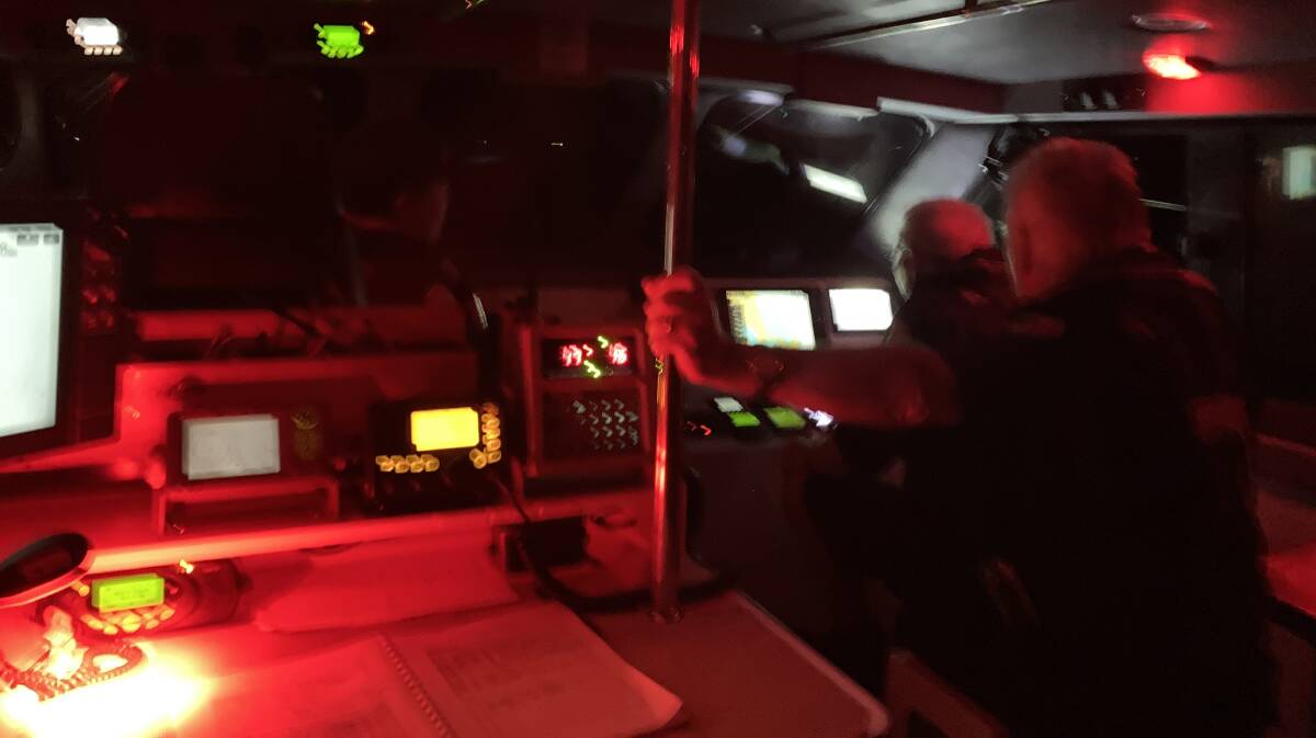 Marine Rescue volunteers on board Bermagui 30 conduct a challenging rescue of anglers on a stricken vessel Sunday night, February 18. Picture supplied
