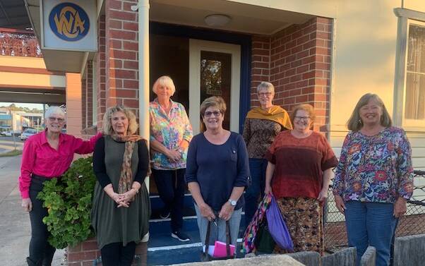 CWA of NSW State Conference committee members Lynn Lawson, Nelleke Gorton, Alison Jenkins, Vicki Hummel, Robyn Wright, Annette Kennewell and Helen Galton on the steps of CWA in Bega. 