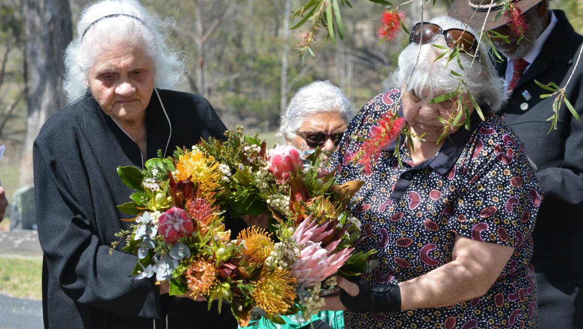 Aunty Margaret Donnelly and her daughter Aunty Charmaine Singleton lay a wreath on the newly dedicated war grave of David Mullett, Aunty Margaret's grandfather. Picture by Ben Smyth