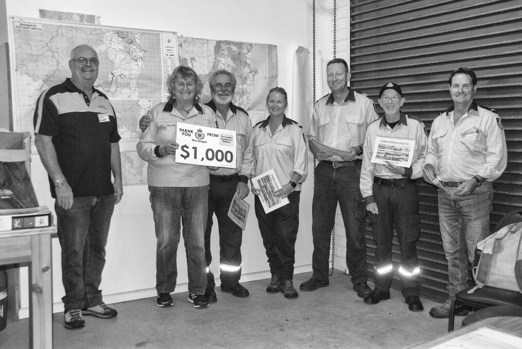 BIG THANKS: Allan Douch gives calendars and a cheque to Maggie McKinney, Brian Blacka, Steph Lazzaro, Tim Holdsworth, Lewis Gaha and Pat Wadell.