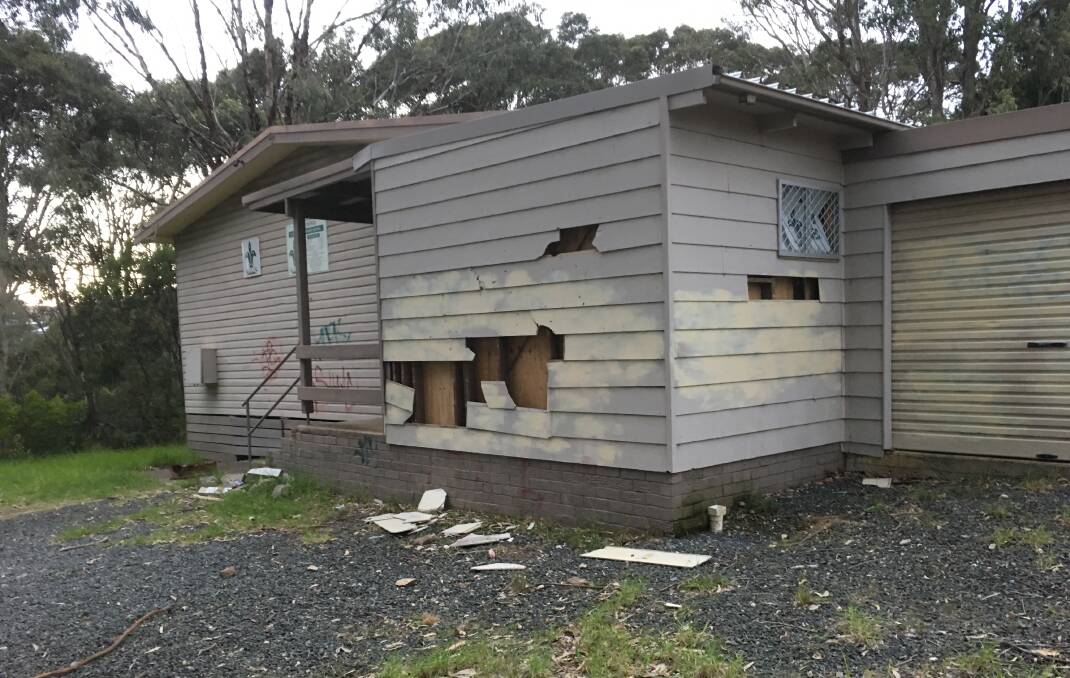 Broken cladding scattered on the ground at the Narooma Sout Hall. 