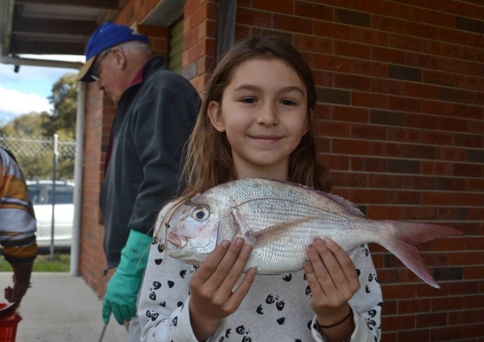 Keen fisher girl Jasmine Zorbas with a nice catch at a previous Sussex Inlet Family Fishing Carnival.