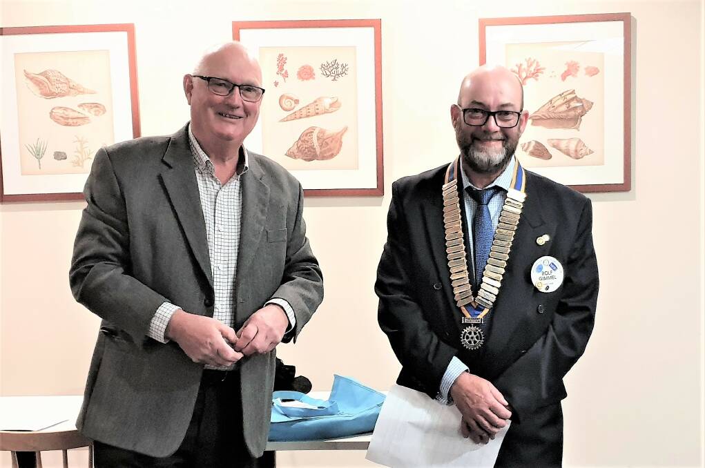 Outgoing Narooma Rotary President Bob Aston handed the chain of office over to
new President Rolf Gimmel.