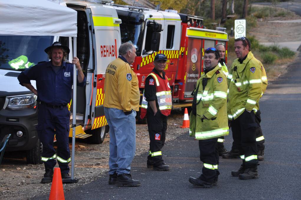 Moruya Fire and Rescue crew finish their lunch break before getting back to their hazard reduction burn duties. 