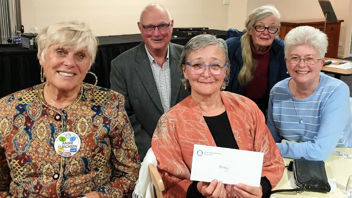Helen Smith of Montys Place received Rotarys $1,500 donation from outgoing
Narooma Rotary President Bob Aston. It was one of many donations given to
local causes through the year. With her are three Rotarian volunteers at
Montys: Ange Ulrichsen (left), Chris OBrien and Robyn Miller (back).