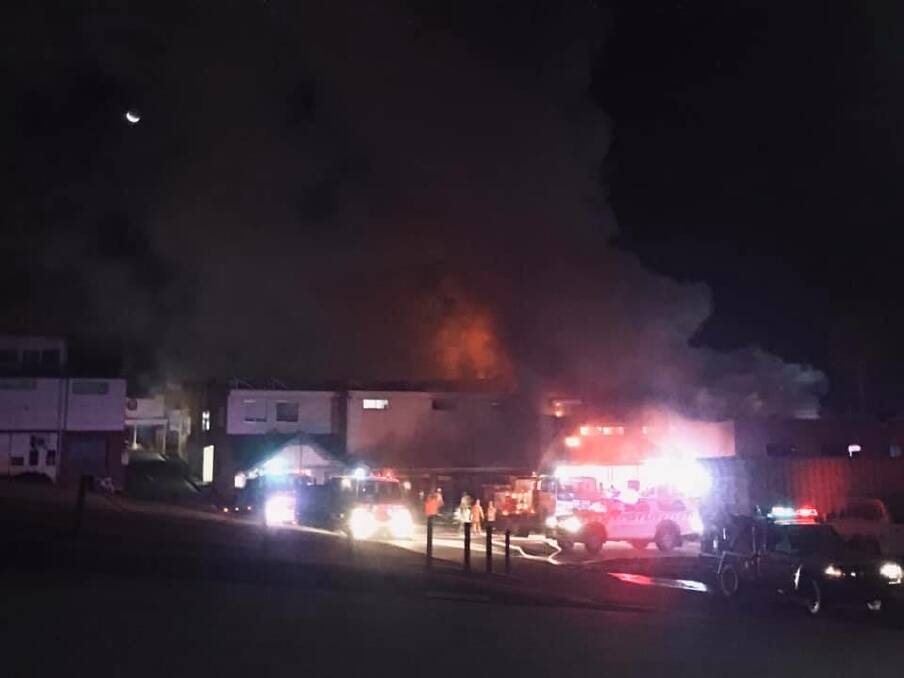 Fire engulfs the building that was home to multiple businesses. Image: Vicki Foscutt.
