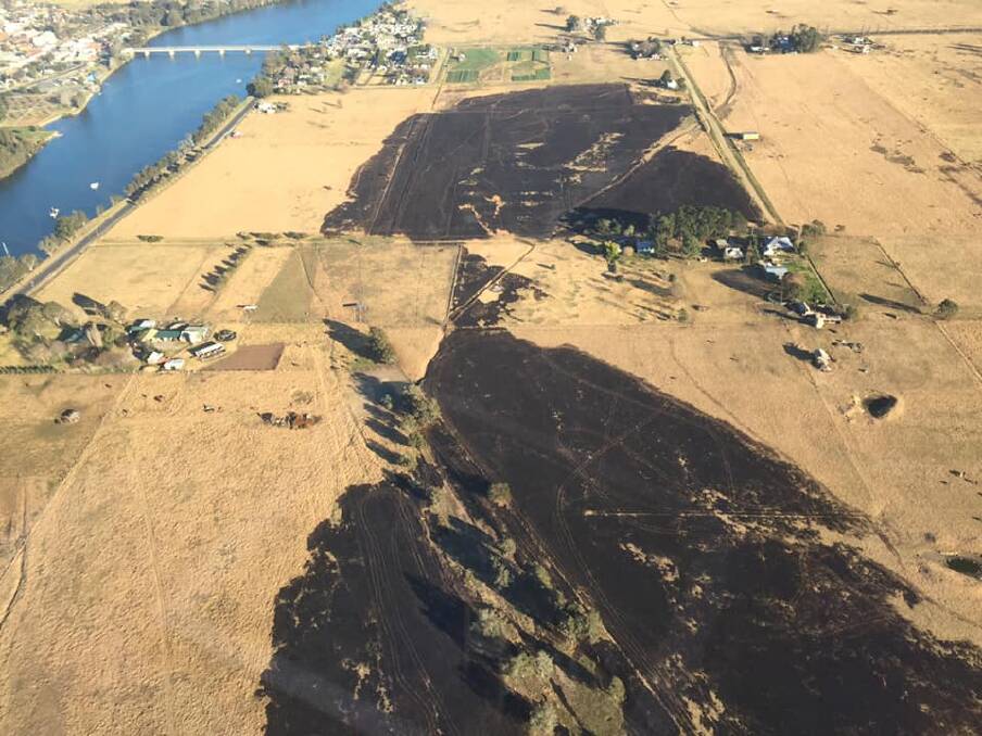 An aerial photograph taken at 1000ft show the extent of the grass fire at Moruya. Image: Fire and Rescue NSW Station 384 Moruya on Saturday, July 13.