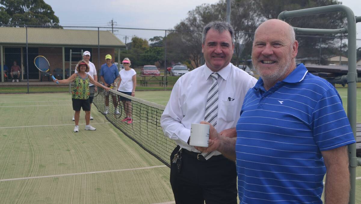 Sucess: Narooma Tennis Club president Roger McEvoy and Club Narooma CEO Tony Casu with local tennis players before last year's tournament. 